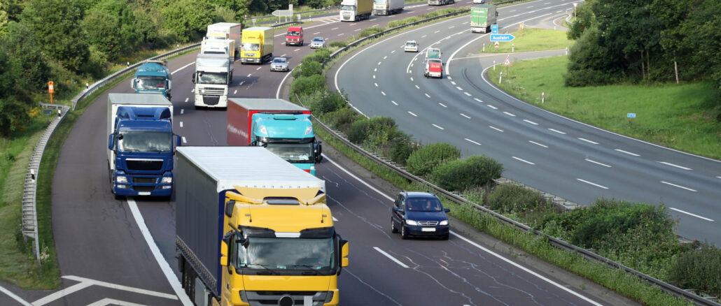 a group of trucks on a highway