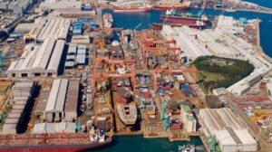 a large port construction yard with many ships